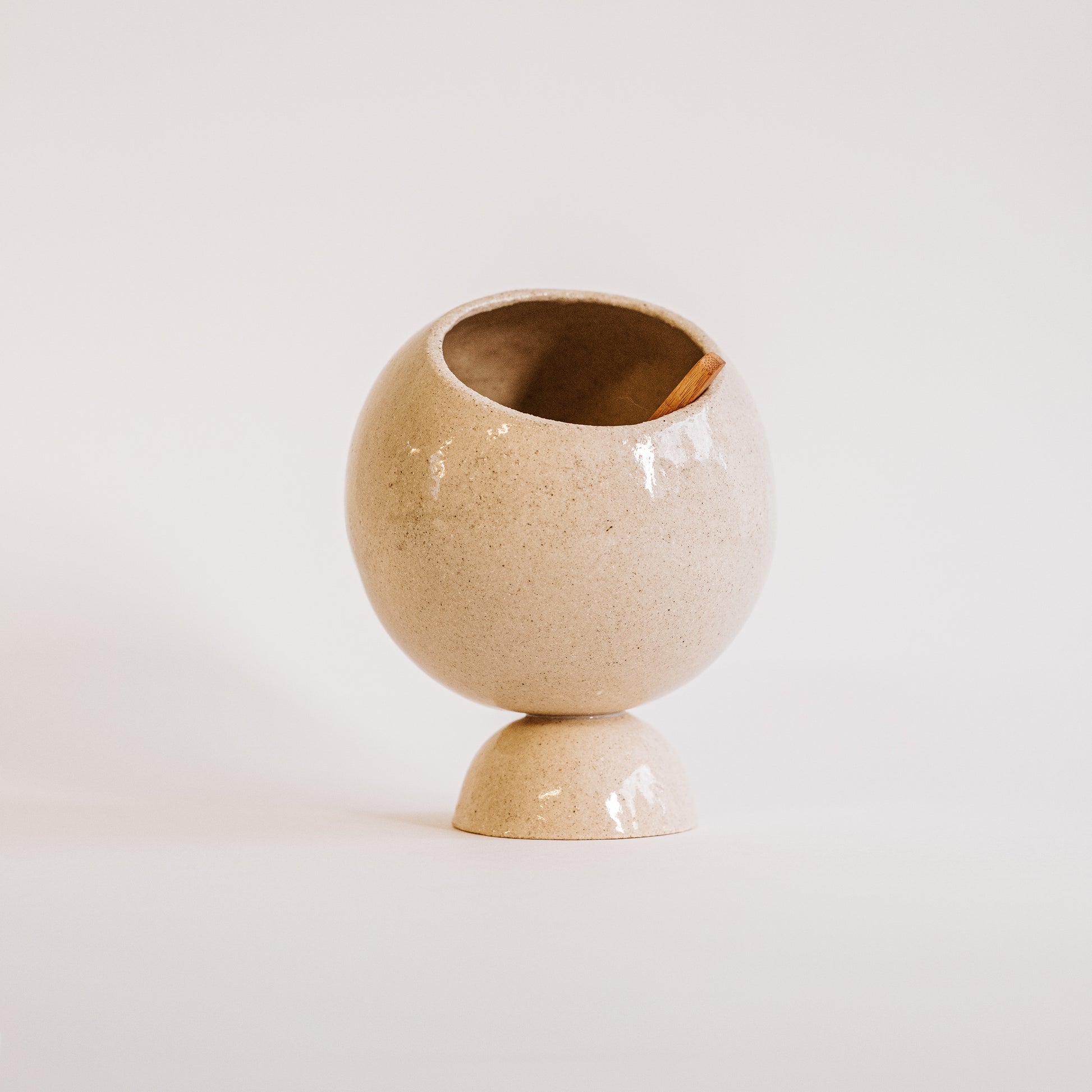 White ceramic salt cellar on a white background