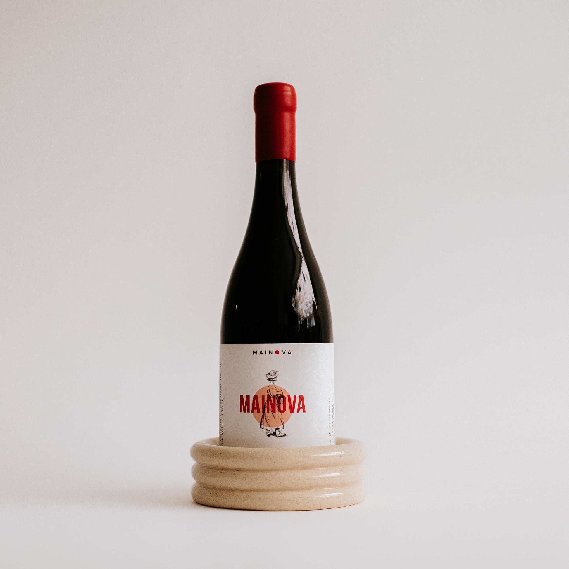 ceramic and red wine bottle support Úrsula Cerâmica
